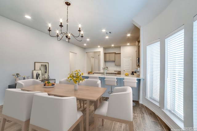 dining area featuring recessed lighting, visible vents, and wood finished floors