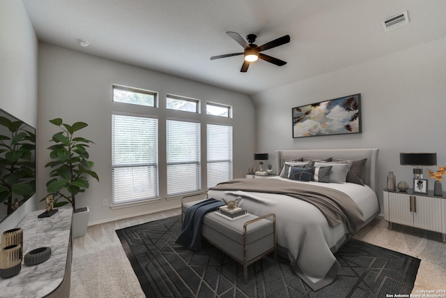 bedroom with visible vents, carpet floors, and a ceiling fan