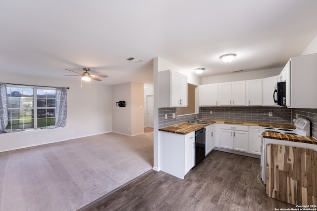 kitchen with dark hardwood / wood-style flooring, white cabinetry, black appliances, ceiling fan, and butcher block counters