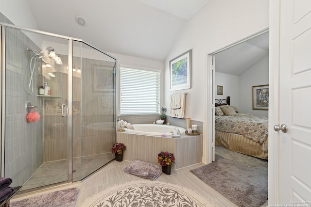 bathroom with shower with separate bathtub and vaulted ceiling