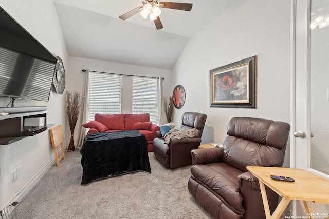 living room featuring light colored carpet, lofted ceiling, and ceiling fan