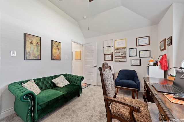 carpeted office with lofted ceiling