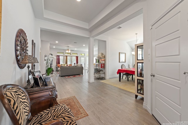 interior space featuring light hardwood / wood-style flooring and decorative columns