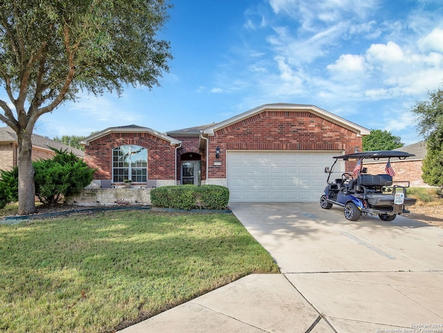 ranch-style house with a garage and a front yard