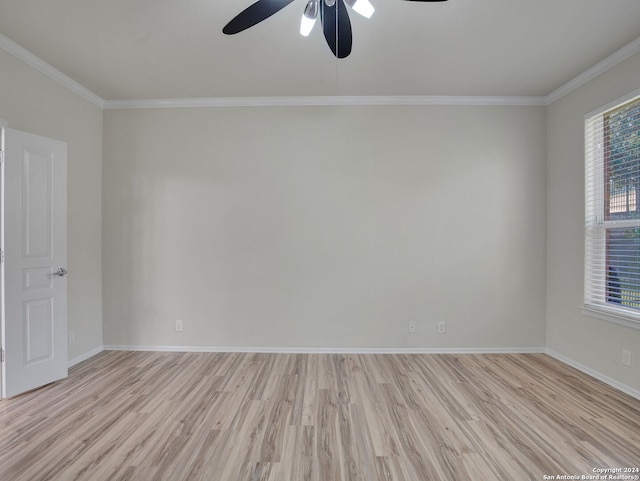 spare room with a healthy amount of sunlight, ceiling fan, and light hardwood / wood-style floors