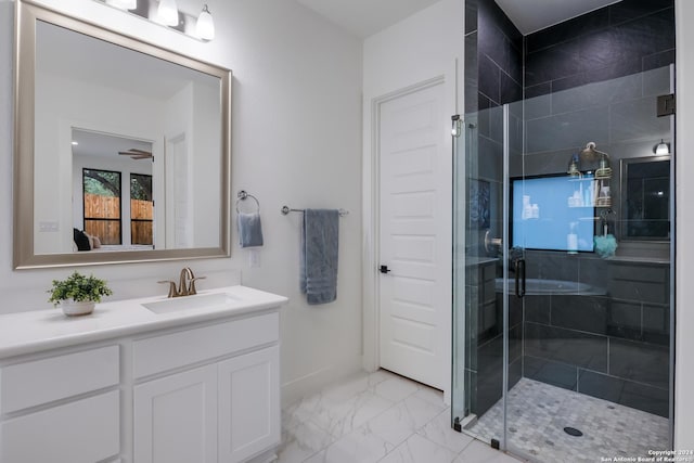full bath featuring baseboards, a shower stall, marble finish floor, and vanity