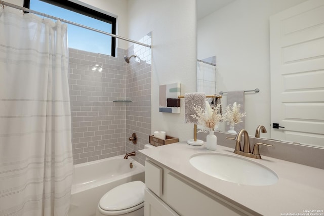 bathroom featuring shower / tub combo with curtain, vanity, and toilet