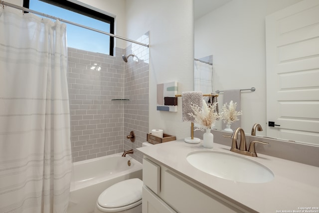 full bathroom featuring toilet, shower / tub combo with curtain, and vanity