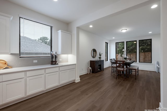 dining room with baseboards, dark wood-style floors, and recessed lighting