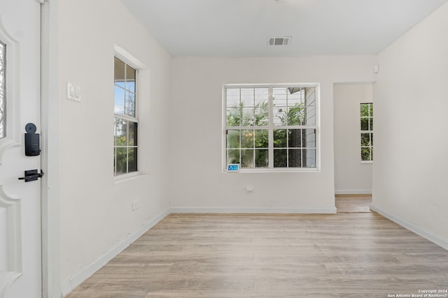 unfurnished room featuring light wood-type flooring