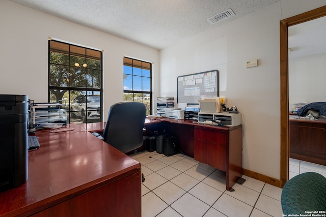 tiled office with a textured ceiling