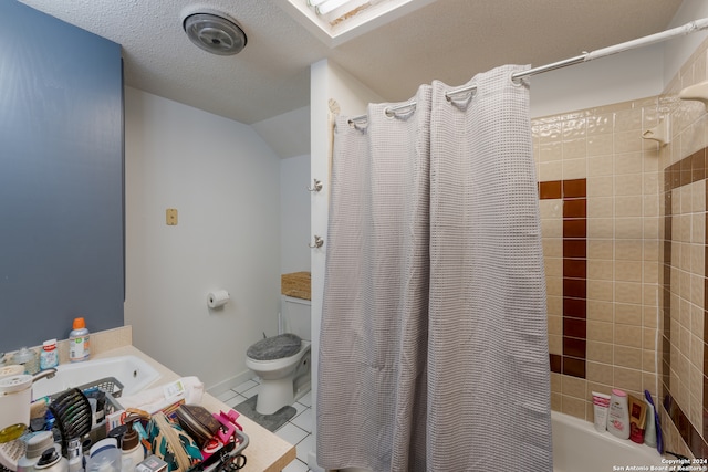 bathroom with a skylight, a textured ceiling, tile patterned floors, toilet, and shower / tub combo with curtain