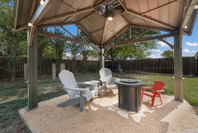 view of patio featuring a gazebo and an outdoor fire pit