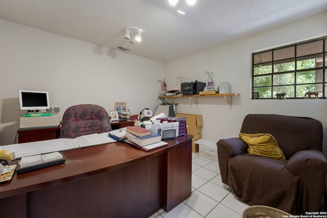 tiled office with a textured ceiling