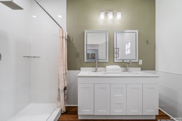 bathroom with vanity, hardwood / wood-style floors, and walk in shower