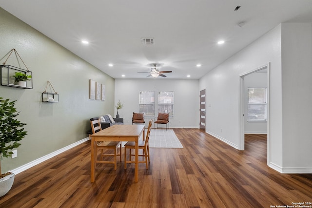 dining space featuring dark wood-type flooring and ceiling fan