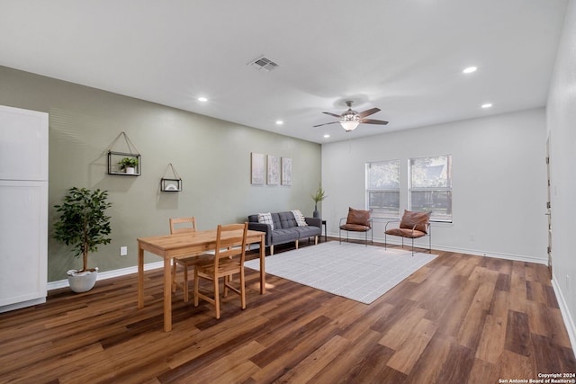 dining space with hardwood / wood-style floors and ceiling fan