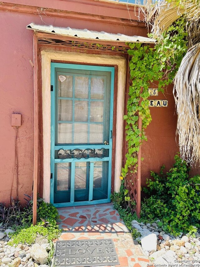 property entrance featuring french doors