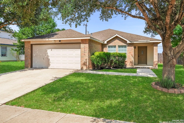 ranch-style home with brick siding, a shingled roof, a front lawn, concrete driveway, and an attached garage