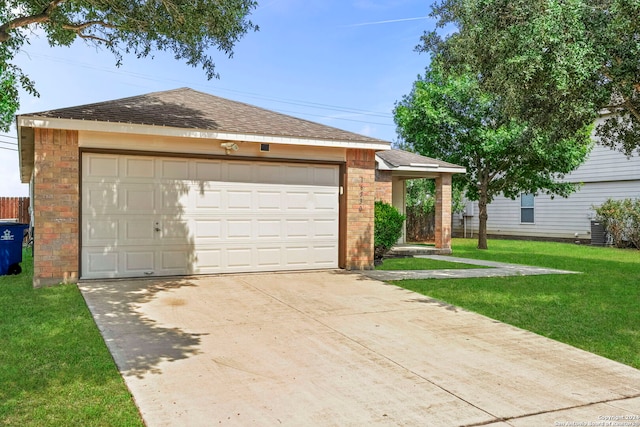 view of front of home featuring an outdoor structure, a front yard, and a garage