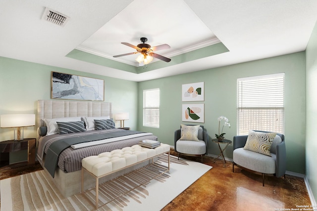 bedroom featuring a tray ceiling, baseboards, visible vents, and ornamental molding