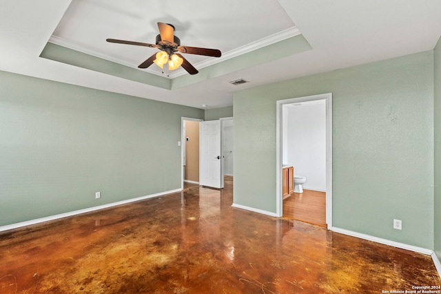 unfurnished bedroom featuring a raised ceiling, baseboards, visible vents, and finished concrete floors