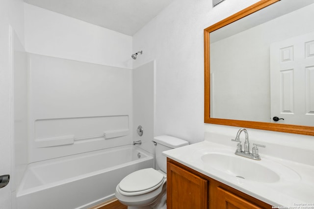 bathroom with toilet, vanity, and washtub / shower combination