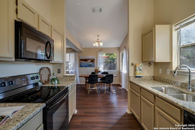 kitchen featuring light stone countertops, dark hardwood / wood-style flooring, black appliances, sink, and a chandelier