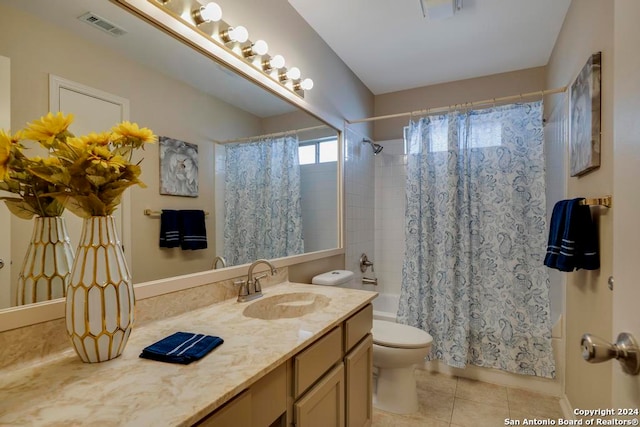 full bathroom with tile patterned flooring, vanity, toilet, and shower / bath combo