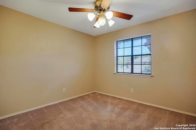 spare room with carpet flooring and ceiling fan