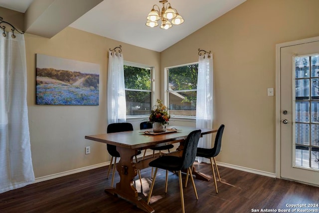 dining room with vaulted ceiling, dark hardwood / wood-style floors, and a chandelier