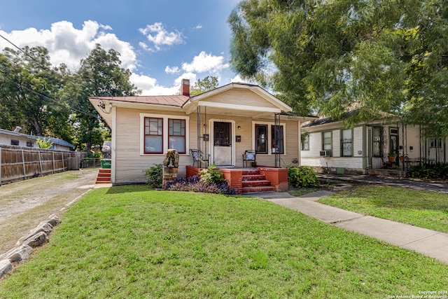 bungalow with a front yard