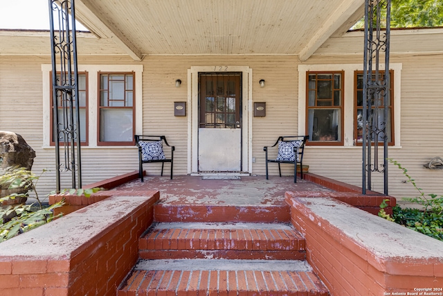 doorway to property featuring a porch