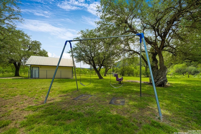 201 N Tomahawk Way, Concan, TX 78801 - surrounding community with a yard and an outbuilding