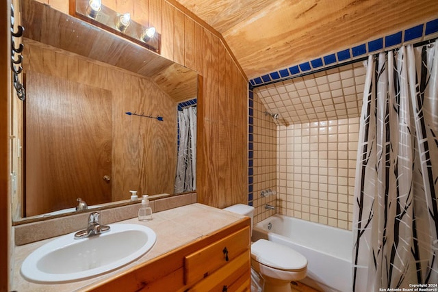 full bathroom featuring vanity, shower / bath combo with shower curtain, wooden walls, toilet, and lofted ceiling