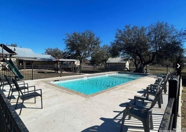 view of swimming pool featuring a patio