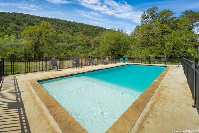 201 N Tomahawk Way, Concan, TX 78801 - community pool with a view of trees