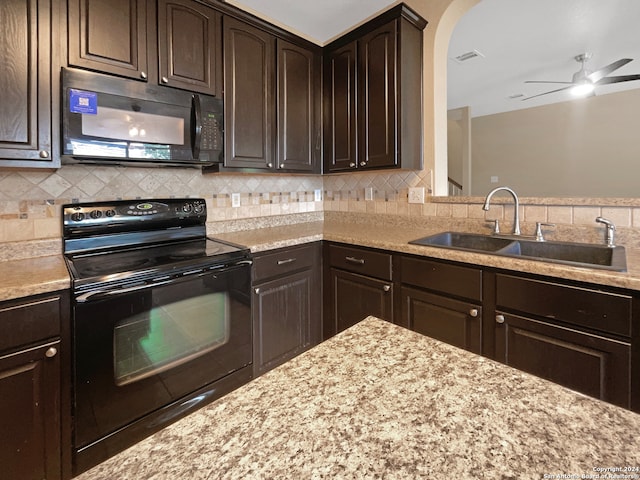 kitchen featuring black appliances, ceiling fan, decorative backsplash, and sink