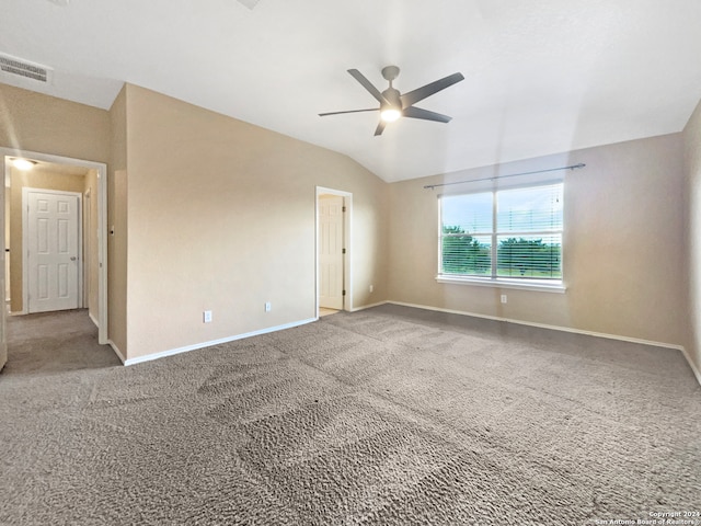 unfurnished room featuring lofted ceiling, carpet flooring, and ceiling fan