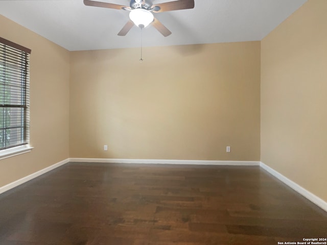 empty room with ceiling fan and hardwood / wood-style flooring