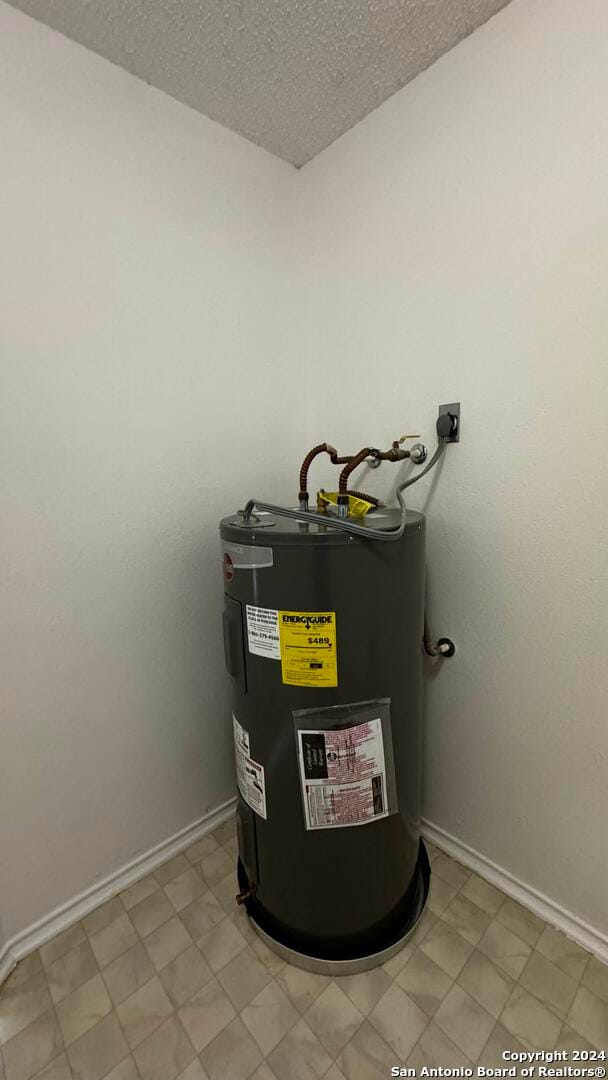 utility room with electric water heater