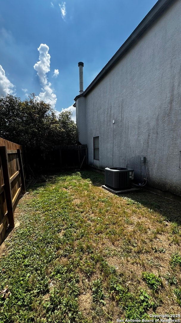 view of yard featuring central AC