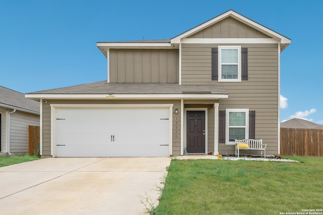 view of front of house featuring a garage and a front yard