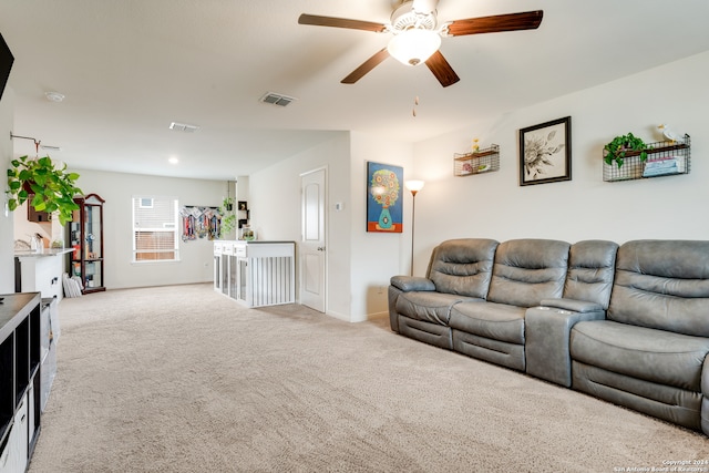 living room with ceiling fan and carpet floors