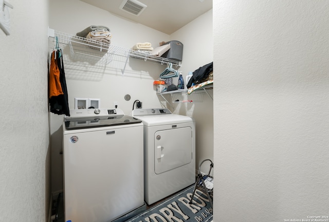 washroom featuring washing machine and dryer