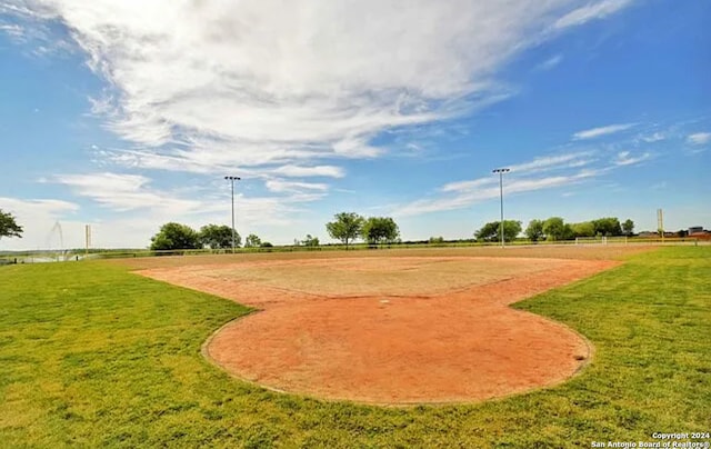 view of property's community featuring a yard