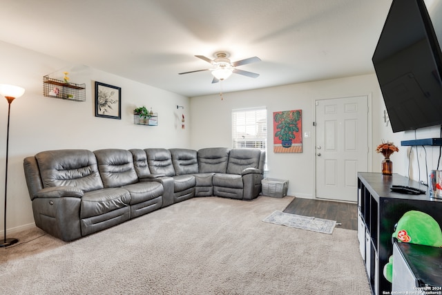 living room featuring hardwood / wood-style floors and ceiling fan