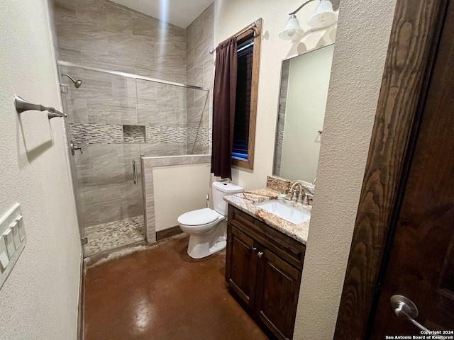 236 Tequila Sunrise, Concan, TX 78838 - bathroom with concrete floors, a stall shower, vanity, and toilet