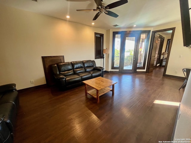 living room featuring dark hardwood / wood-style floors and ceiling fan