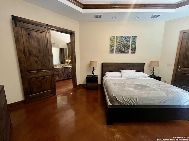 bedroom with a barn door, ornamental molding, and ensuite bathroom